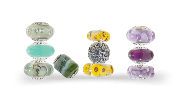 A Bijoux Chat blog post banner featuring macros of colorful glass and one silver European charm bracelet beads on a white background.