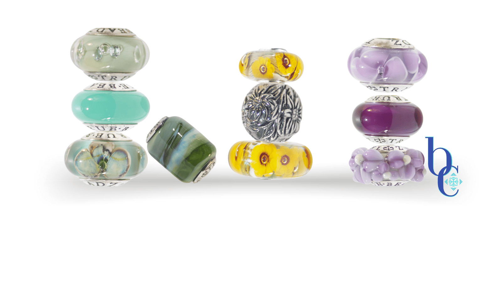 A Bijoux Chat blog post banner featuring macros of colorful glass and one silver European charm bracelet beads on a white background.