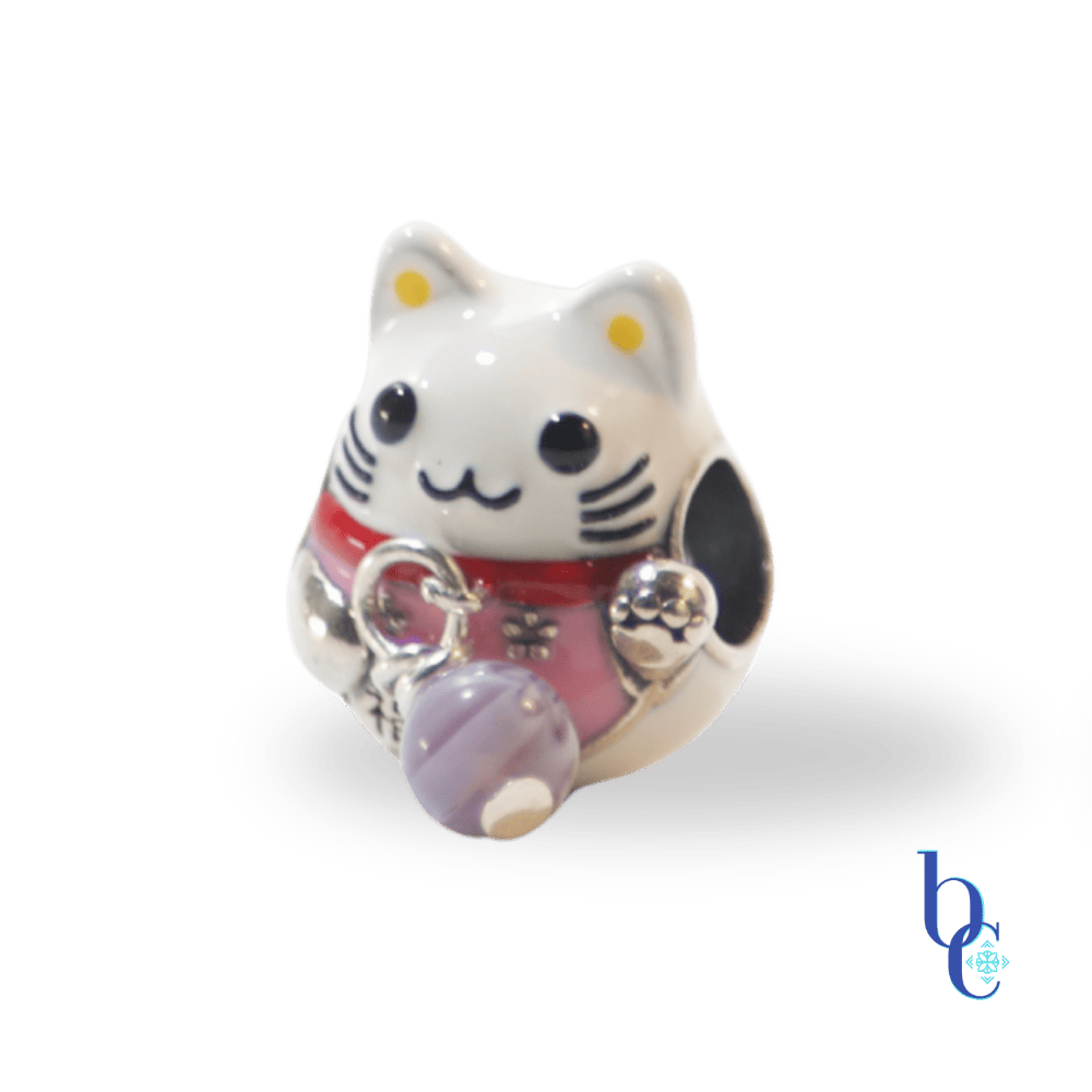 A revitalized "Wabi-Sabi" fix on my Palace of Amber Maneki Neko charm with an added tiny lavender milleflori bead attached by a silver wire where her original bell was missing.