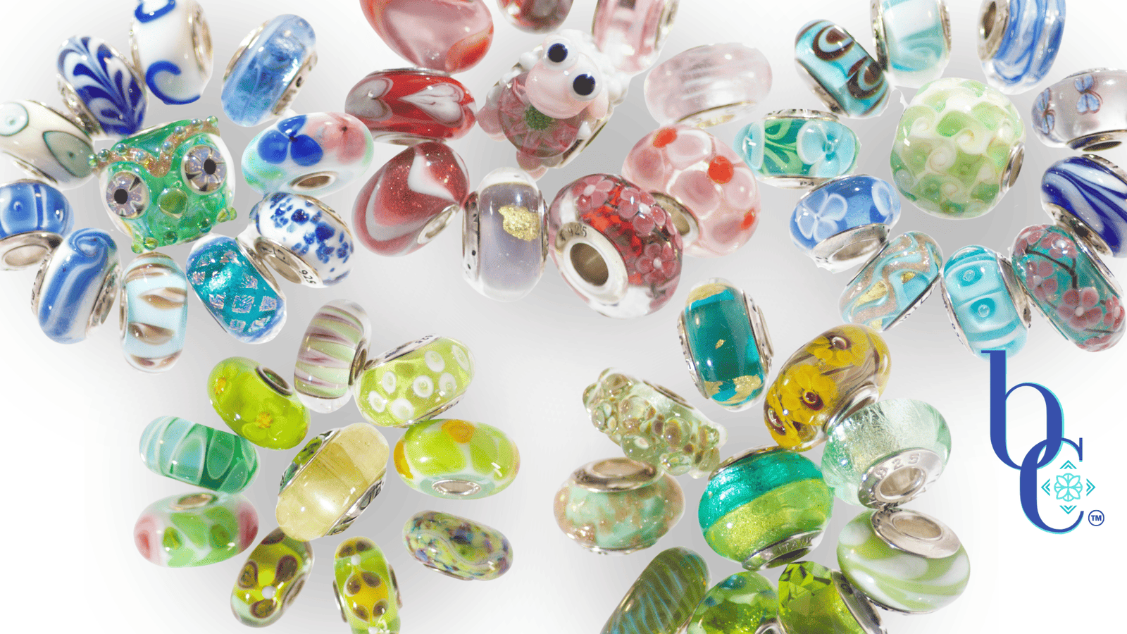 Bijoux Chat's main motto with stylized flowers with the flower heads made of pictures of colorful European bracelet bead charms.