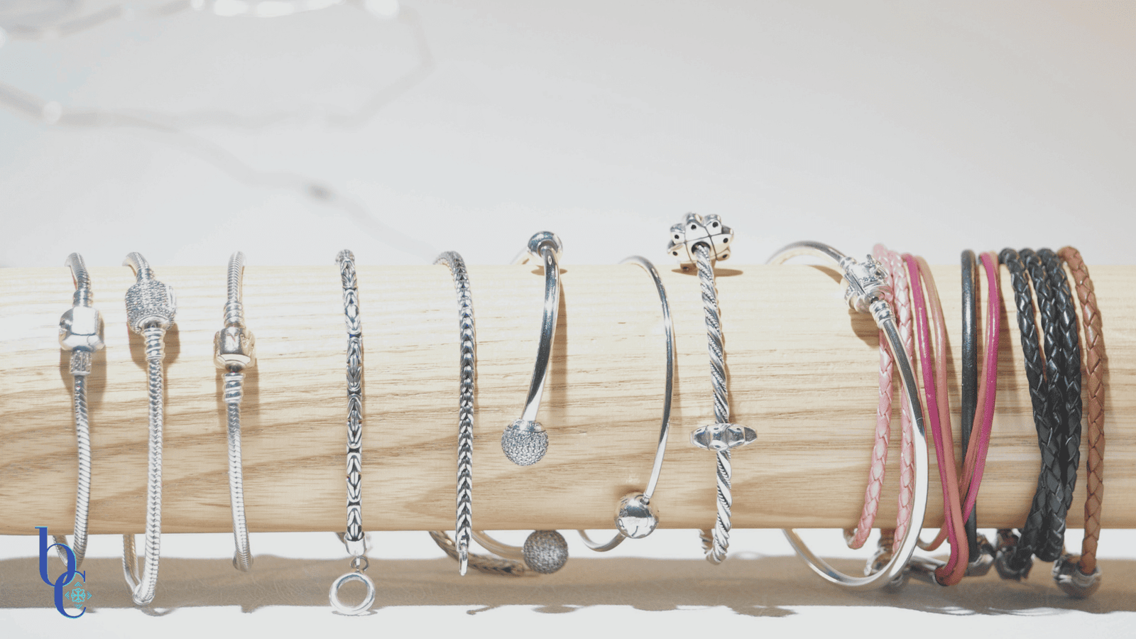 A macro banner with a white background created by Bijoux Chat.com to show readers all the different styles of sterling silver European bracelet carriers.