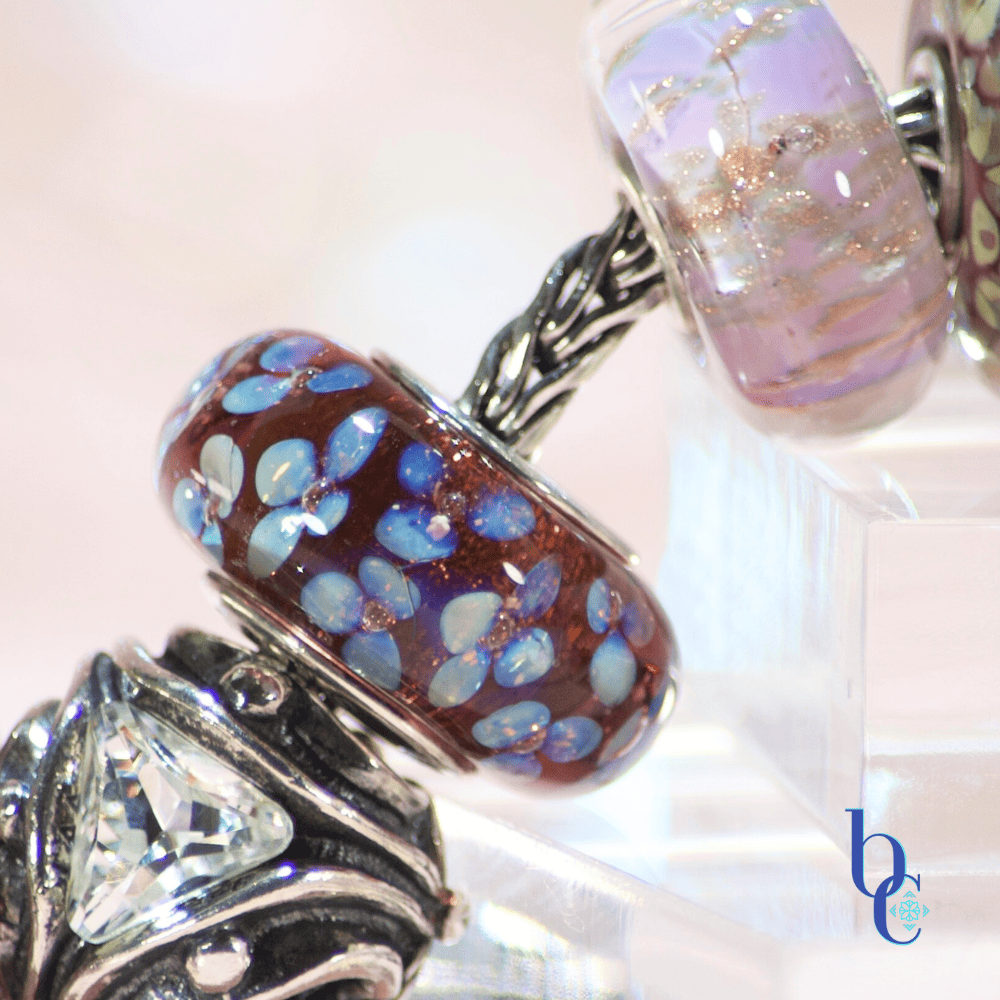 Bijoux Chat's macro image of a purple and silver dichroic trollbeads european bead bracelet.