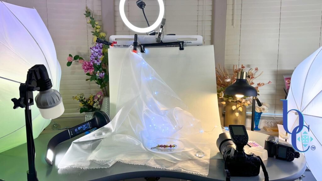 Discover the real photography and creative process behind Bijoux Chat. Learn how the CharmStack© Visualizer ensures authentic European charm bracelet designs. An image of the simple studio setup to photograph the blog's designs.