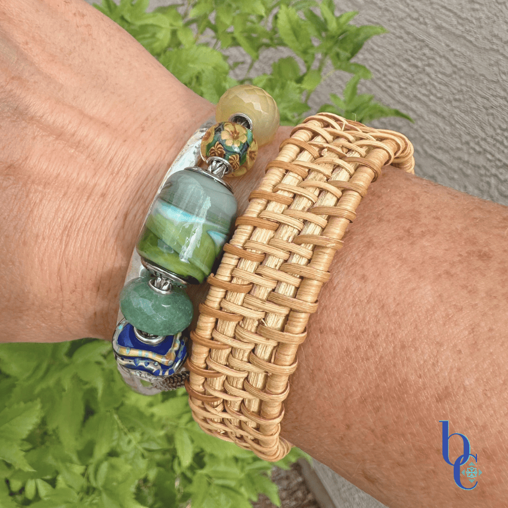 Explore "Ripples in Glass"—a 5-piece charm bracelet design inspired by Vermont summer lakeside life. Featuring TrueBeadz, Trollbeads, and natural faceted minerals styled for an artsy aesthetic on a woman's wrist.